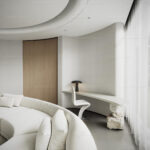 Minimalist White Living Room with Curved Sofa and Modern Desk - 3D Model_1156372390